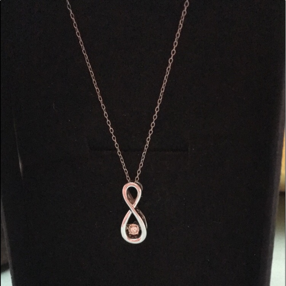Silver diamond pendant.